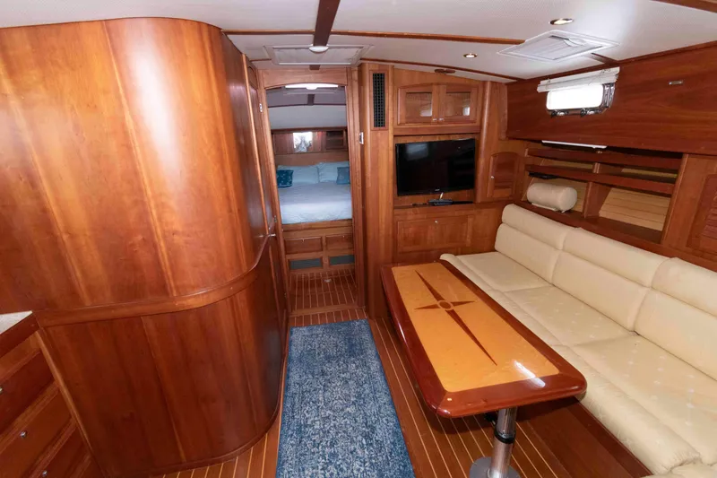 Slide: The Image of 2005 Sabre 38 Hardtop Express boat interior with helm, steering wheel, and navigation equipment. - 21