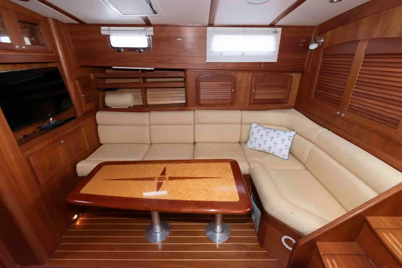 Slide: The Image of 2005 Sabre 38 Hardtop Express helm with navigation equipment and wooden steering wheel. - 23