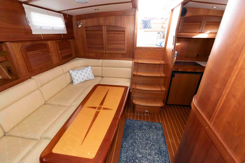 Slide: The Image of 2005 Sabre 38 Hardtop Express helm with navigation equipment and wooden steering wheel. - 24