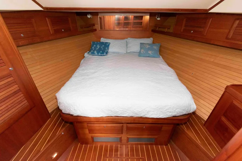 Slide: The Image of 2005 Sabre 38 Hardtop Express interior with seating, helm chair, and nautical decor. - 25