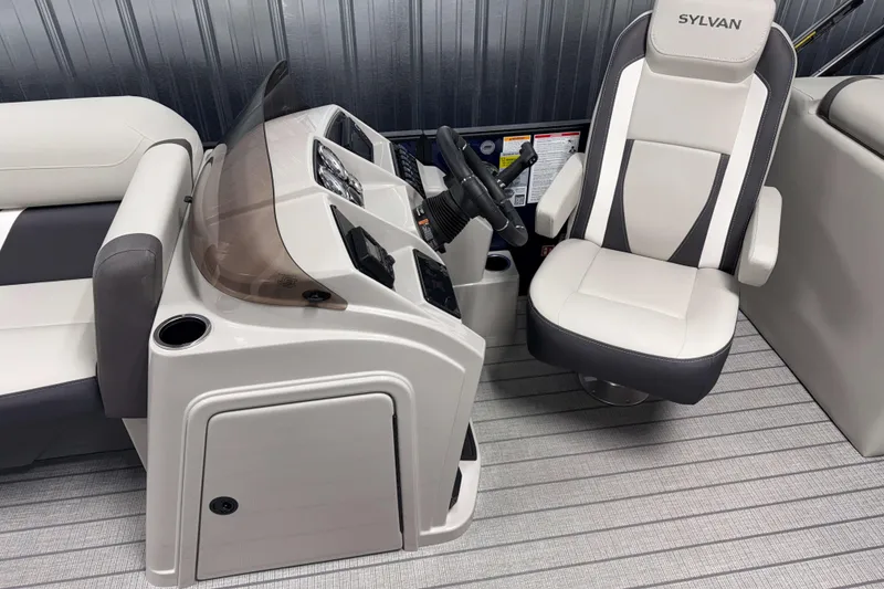 Slide: The Image of 2026 Sylvan Mirage X3 boat interior with captain's chair and control console. - 4