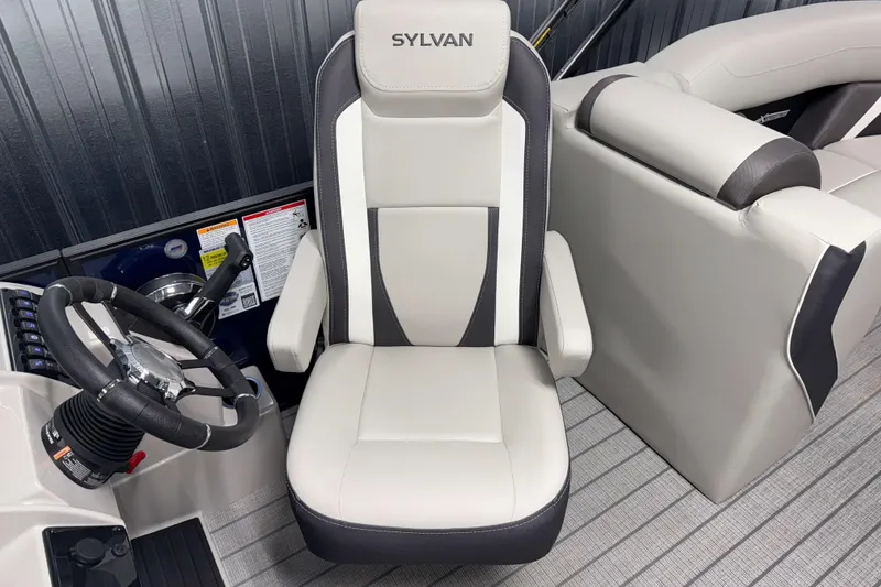 Slide: The Image of Captain's seat and steering wheel of 2026 Sylvan Mirage X3 boat, featuring sleek design. - 6