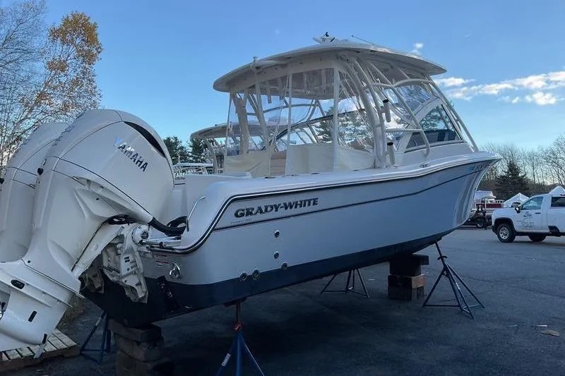 Slide: The Image of 2025 Grady-White Freedom 285 boat with Yamaha engines on display outdoors. - 3