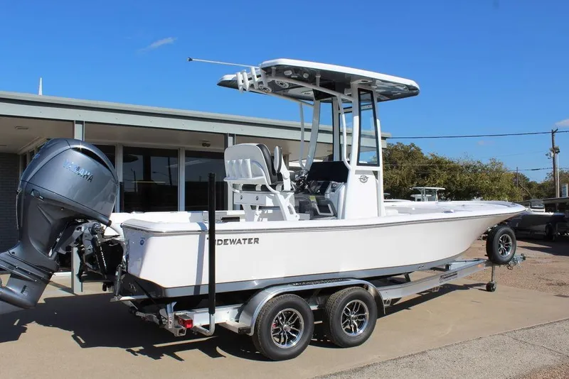 Slide: The Image of 2025 Tidewater 2210 Carolina Bay boat on trailer, featuring Yamaha outboard motor. - 1