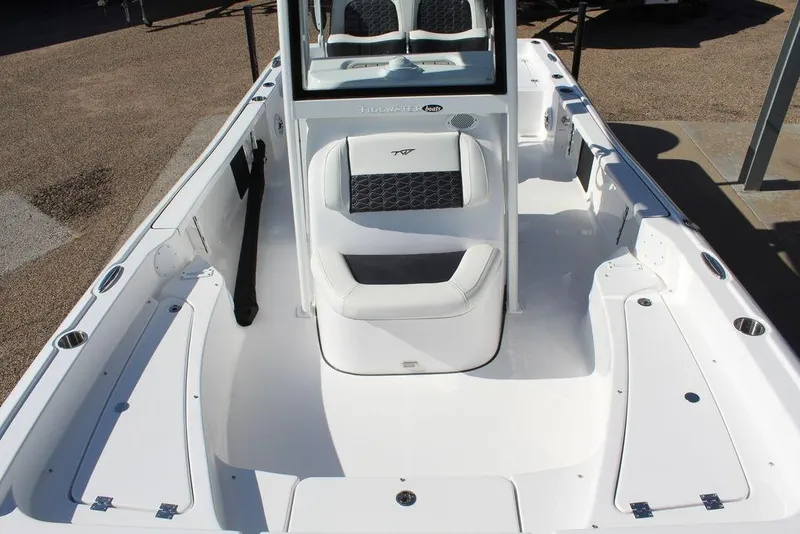 Slide: The Image of 2025 Tidewater 2210 Carolina Bay boat interior with seating and storage compartments. - 16