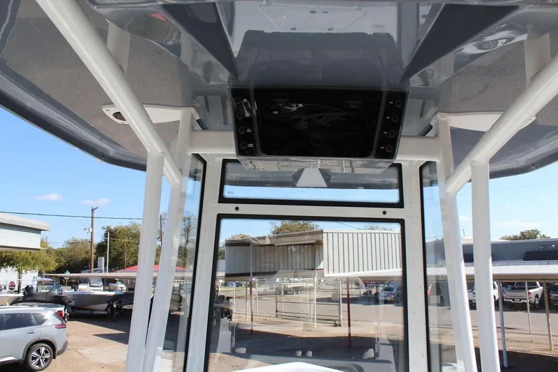 Slide: The Image of 2025 Tidewater 2210 Carolina Bay boat interior with modern design and clear windows. - 17