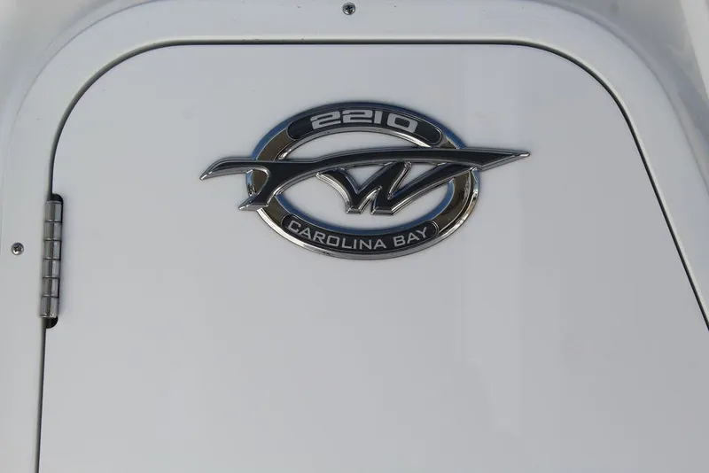 Slide: The Image of 2025 Tidewater 2210 Carolina Bay logo on white boat surface. - 19