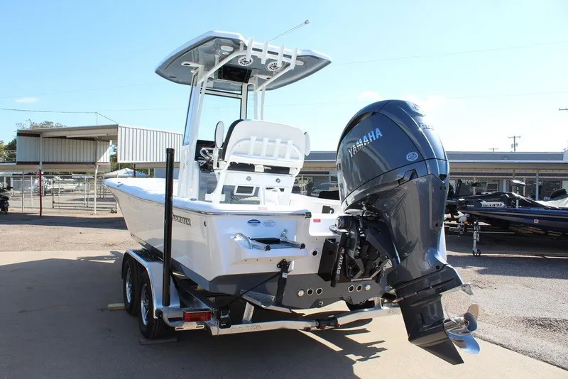 Slide: The Image of 2025 Tidewater 2210 Carolina Bay boat with Yamaha outboard engine on trailer. - 2