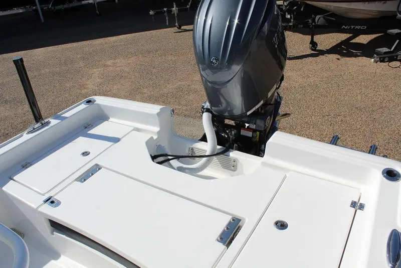 Slide: The Image of 2025 Tidewater 2210 Carolina Bay boat with outboard motor, rear deck view. - 5