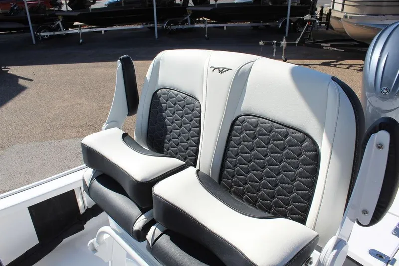 Slide: The Image of 2025 Tidewater 2210 Carolina Bay boat seats with black and white upholstery. - 8