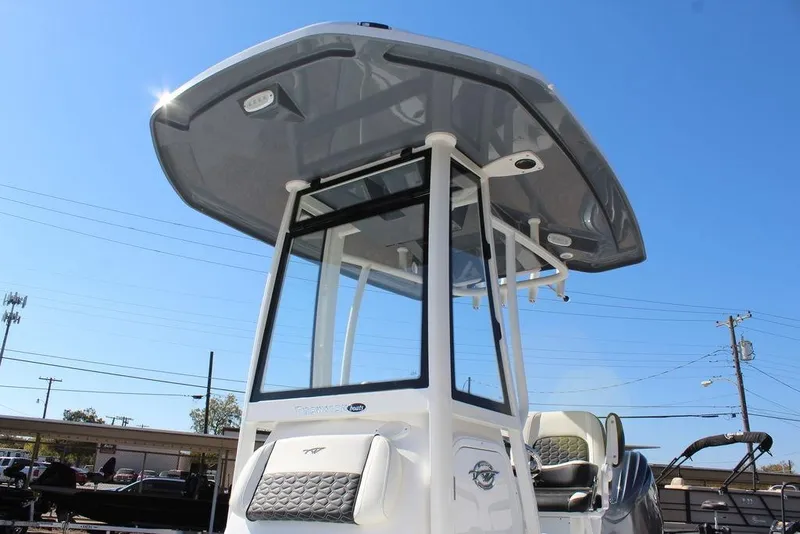 Slide: The Image of 2025 Tidewater 2210 Carolina Bay boat with T-top under clear blue sky. - 9