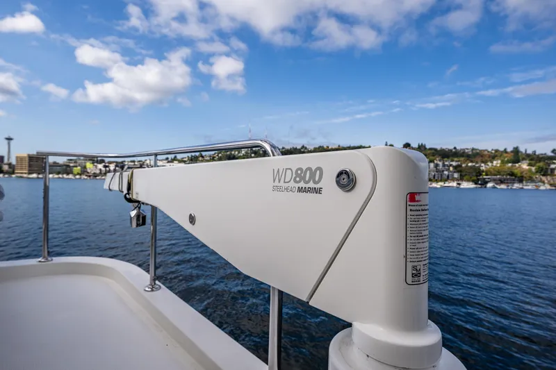 Slide: The Image of Ocean Alexander 52 Sedan 2009 yacht with Steelhead Marine WD800 crane, scenic waterfront view. - 13