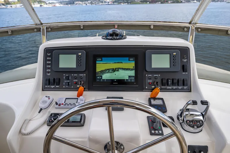 Slide: The Image of Helm of 2009 Ocean Alexander 52 Sedan yacht with navigation controls and display screens. - 17
