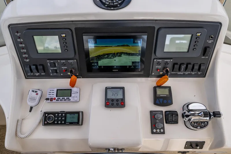 Slide: The Image of Control panel of a 2009 Ocean Alexander 52 Sedan yacht with navigation and communication equipment. - 21
