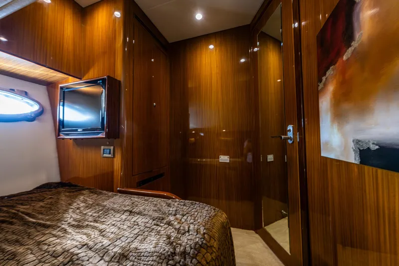 Slide: The Image of VIP cabin of 2009 Ocean Alexander 52 Sedan yacht with wood paneling and modern decor. - 39