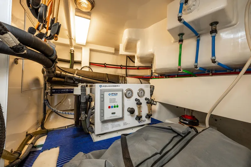 Slide: The Image of Engine room of 2009 Ocean Alexander 52 Sedan with Aquamiser+ watermaker system and piping. - 43