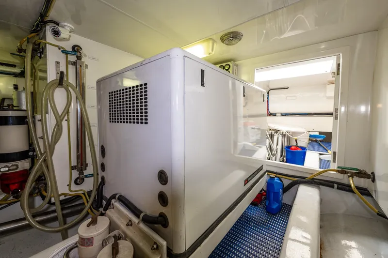 Slide: The Image of Engine room of 2009 Ocean Alexander 52 Sedan yacht, featuring generator. - 44