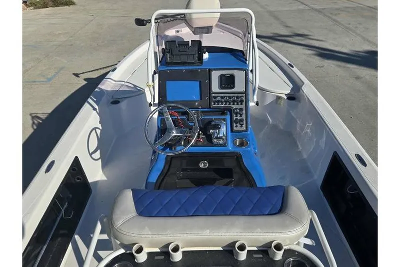 Slide: The Image of 2020 Blue Wave 2400 PureBay boat interior with modern dashboard and steering wheel. - 11