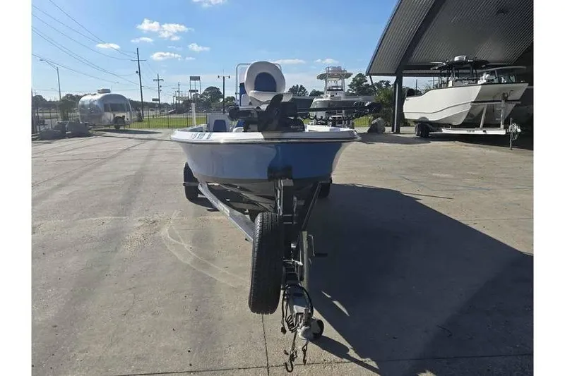 Slide: The Image of 2020 Blue Wave 2400 PureBay boat on trailer in outdoor dealership lot. - 2