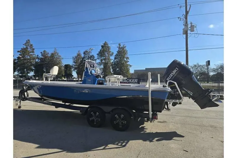 Slide: The Image of 2020 Blue Wave 2400 PureBay boat with Suzuki outboard motor on trailer. - 4