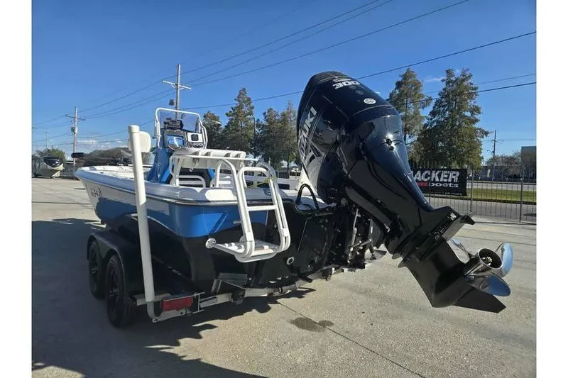 Slide: The Image of 2020 Blue Wave 2400 PureBay boat with Suzuki outboard motor on trailer. - 5