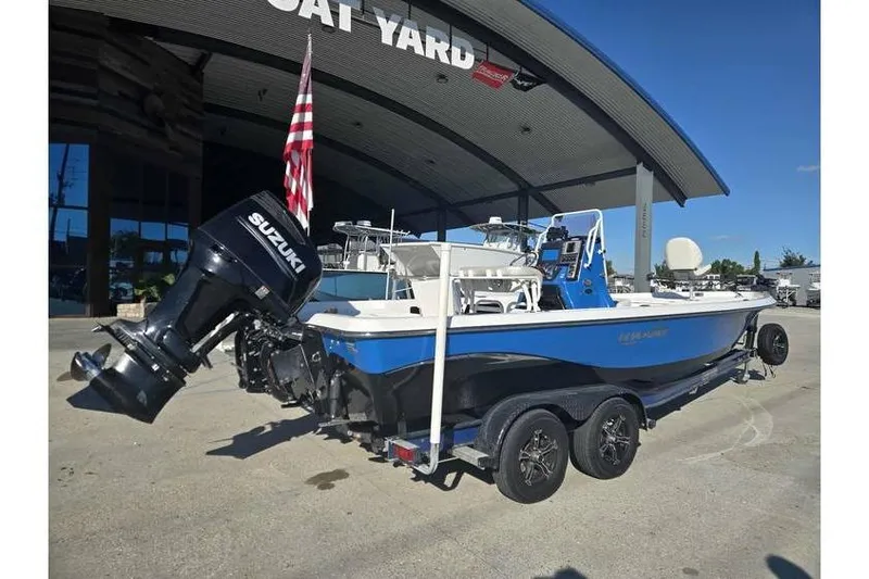 Slide: The Image of 2020 Blue Wave 2400 PureBay boat with Suzuki engine at a boat yard. - 7