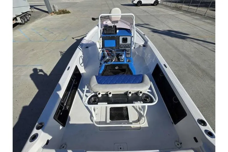 Slide: The Image of 2020 Blue Wave 2400 PureBay boat interior with steering console and seating. - 8