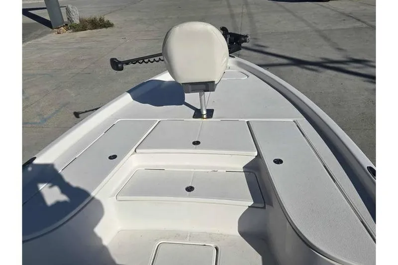 Slide: The Image of 2020 Blue Wave 2400 PureBay boat deck with seating and storage compartments. - 9