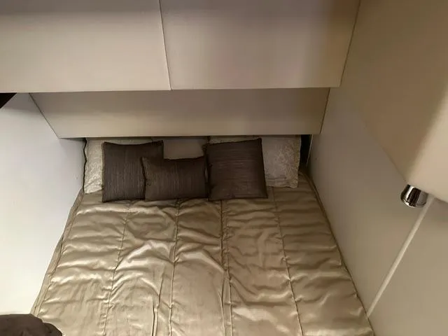 Slide: The Image of Interior cabin of 2016 Carver C34 Command Bridge with cozy bedding and pillows. - 17
