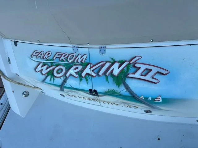 Slide: The Image of 2016 Carver C34 Command Bridge with "Far From Workin' II" painted on the stern. - 25