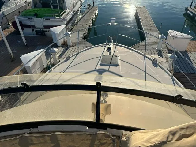 Slide: The Image of 2016 Carver C34 Command Bridge yacht docked at marina, viewed from above. - 3