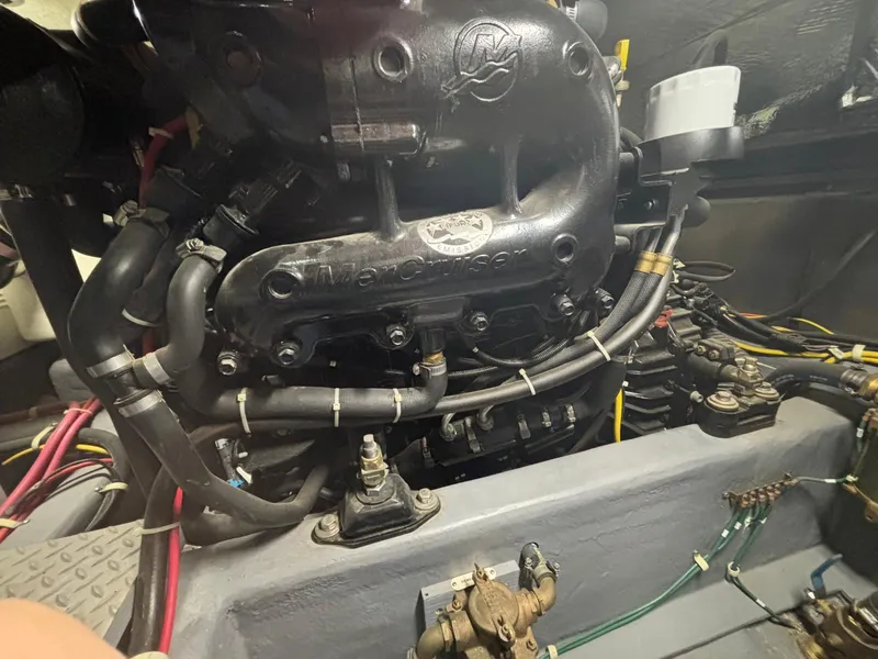 Slide: The Image of Engine compartment of a 2016 Carver C34 Command Bridge boat, showcasing mechanical components. - 33
