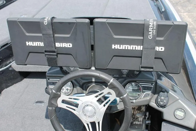 Slide: The Image of 2021 Skeeter FXR21 boat dashboard with dual Humminbird displays and Garmin LiveScope. - 6