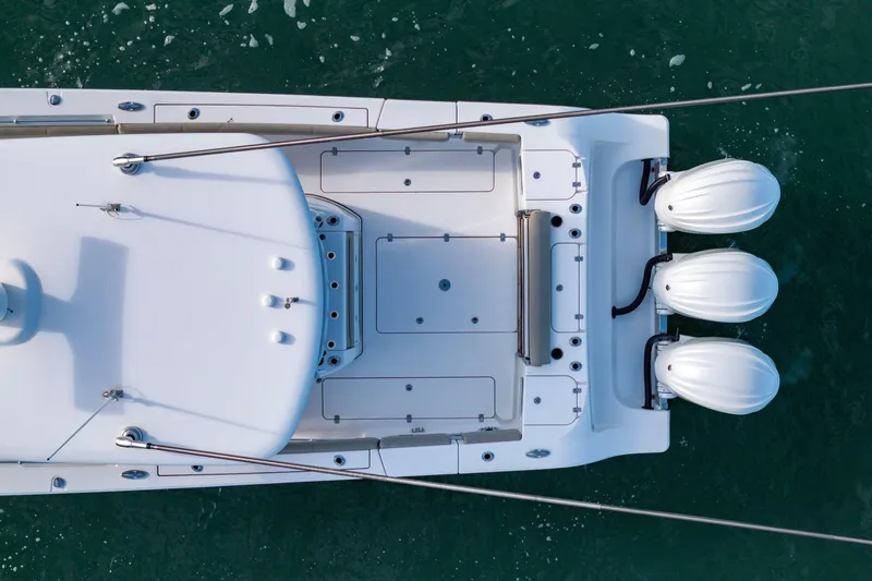 Slide: The Image of Top view of 2022 Sportsman Open 352 Center Console boat on water. - 12