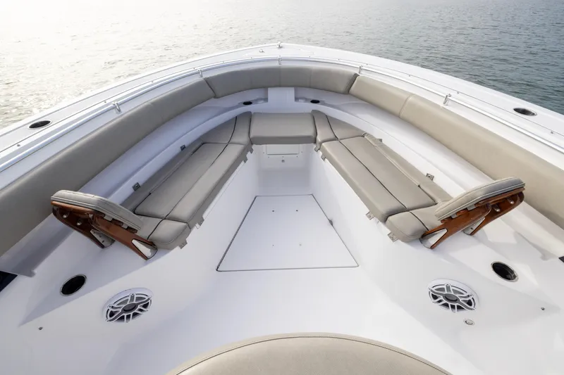 Slide: The Image of 2022 Sportsman Open 352 Center Console boat interior with cushioned seating and ocean view. - 13