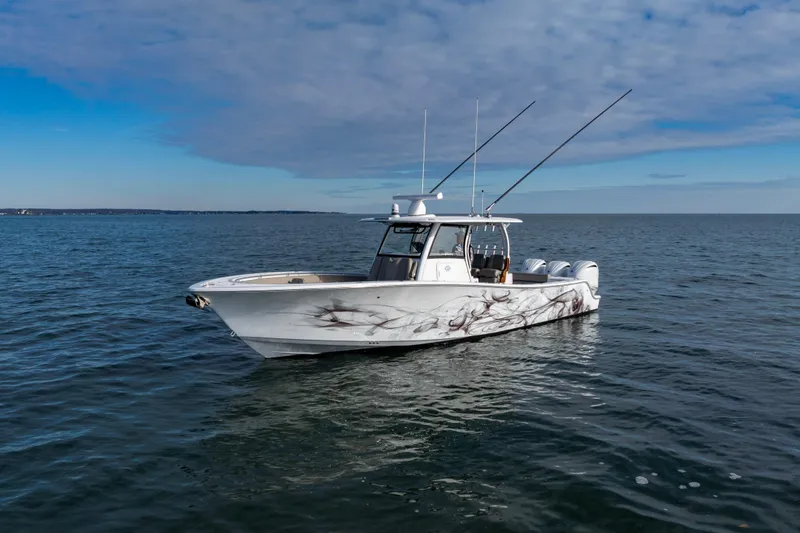 Slide: The Image of 2022 Sportsman Open 352 Center Console boat on calm ocean waters. - 3