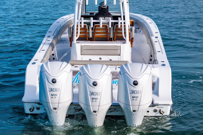 Slide: The Image of 2022 Sportsman Open 352 Center Console with triple 300 V6 engines on the water. - 34