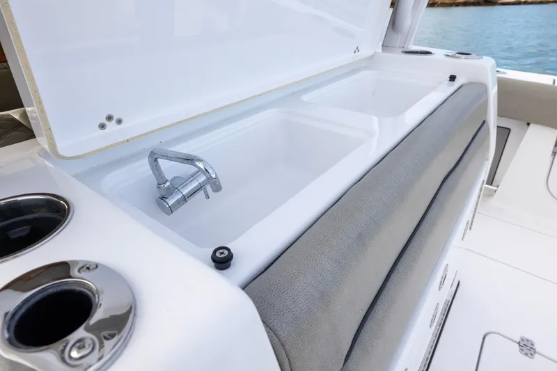 Slide: The Image of 2022 Sportsman Open 352 Center Console boat sink and faucet detail. - 40