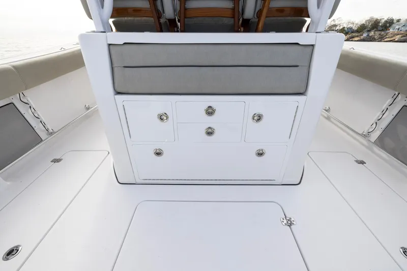 Slide: The Image of 2022 Sportsman Open 352 Center Console interior with storage compartments and seating. - 42