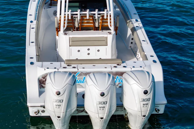 Slide: The Image of 2022 Sportsman Open 352 Center Console boat with triple 300 V6 engines on water. - 46