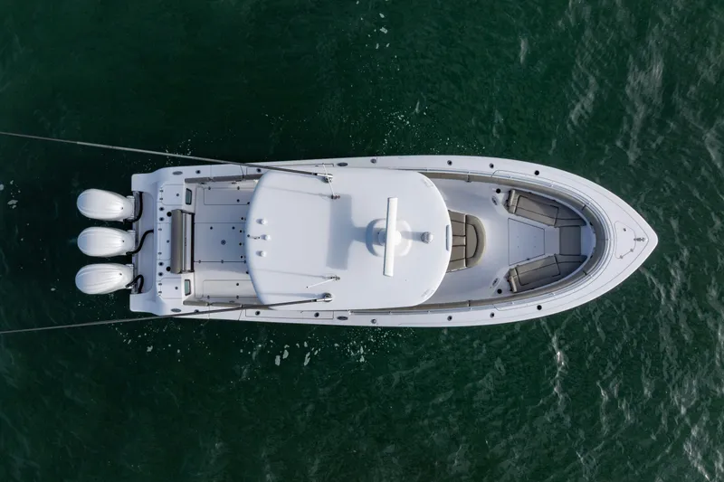 Slide: The Image of Overhead view of 2022 Sportsman Open 352 Center Console boat on water. - 48