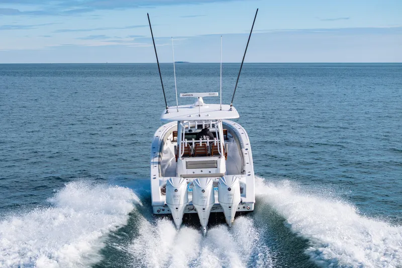 Slide: The Image of 2022 Sportsman Open 352 Center Console boat cruising on open water. - 49