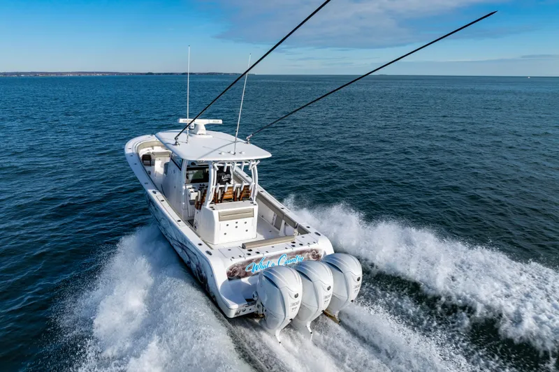 Slide: The Image of 2022 Sportsman Open 352 Center Console boat cruising on open water. - 50