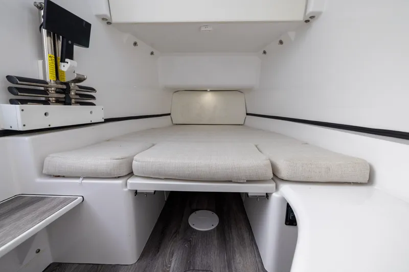 Slide: The Image of 2022 Sportsman Open 352 Center Console cabin interior with cushioned seating and modern design. - 54