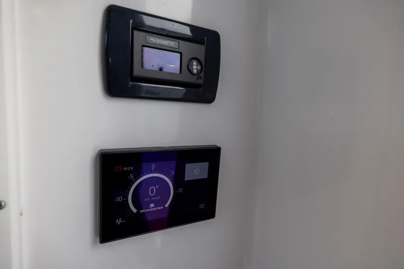 Slide: The Image of Control panels on a 2022 Sportsman Open 352 Center Console boat. - 59