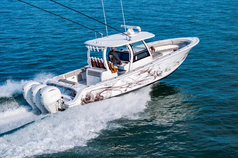 Slide: The Image of 2022 Sportsman Open 352 Center Console boat cruising on open water. - 6