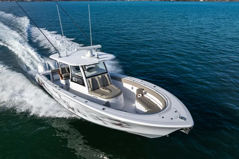 Slide: The Image of 2022 Sportsman Open 352 Center Console cruising on open water. - 7