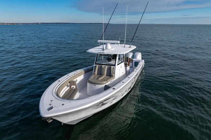Slide: The Image of 2022 Sportsman Open 352 Center Console boat on calm ocean waters. - 8
