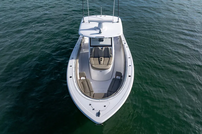 Slide: The Image of 2022 Sportsman Open 352 Center Console boat on calm water, aerial view. - 9