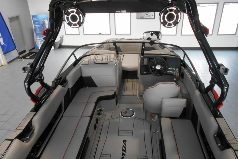 Slide: The Image of 2023 Moomba Max boat interior with modern seating and advanced dashboard features. - 10